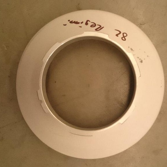 An 819 mm Reggiani rotary screen head, with its size and machine make written on it