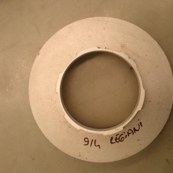 A 914 mm Reggiani rotary screen head, with its size and machine make written on it