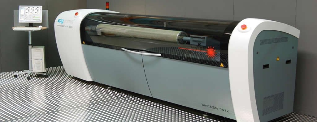 A rotary screen cylinder being engraved on a laser engraving machine