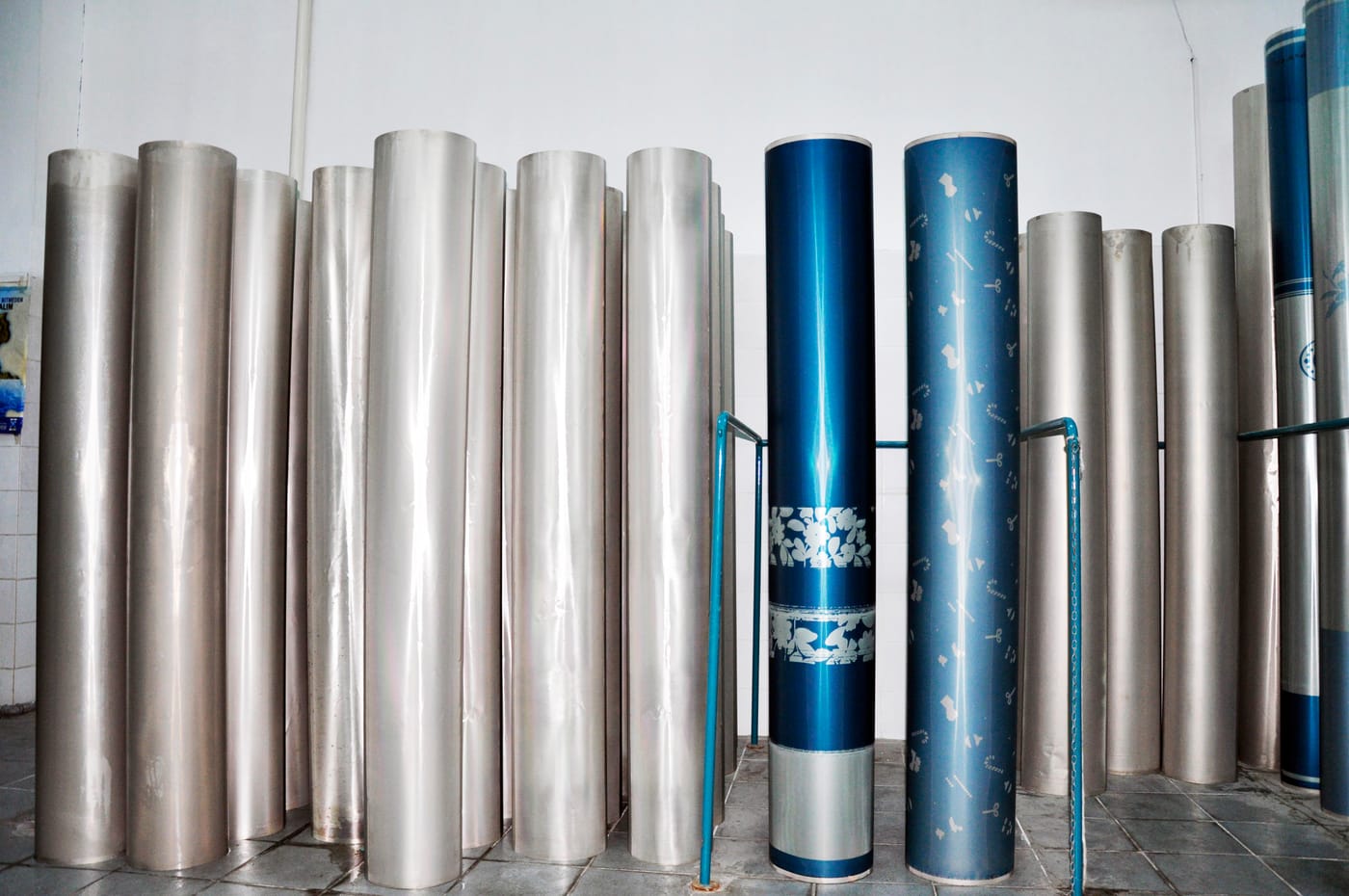 Finished rotary screens stored upright in the production hall